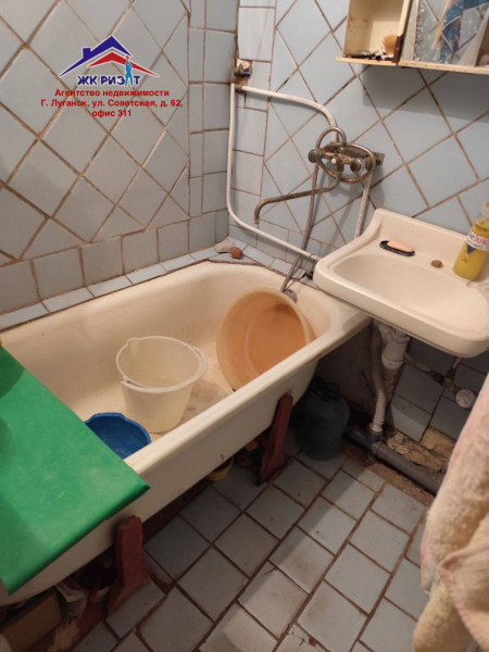 Фото Четырехкомнатная квартира на 50-лет Октября